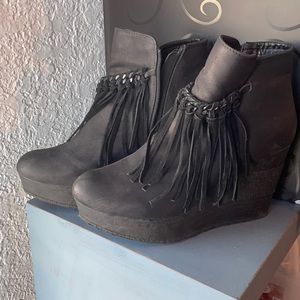 Black leather booties with fringe. Never worn. Zipper closure. Size 10. Sbicca